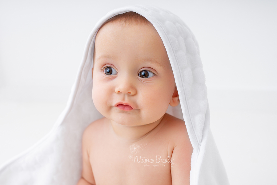 baby in white towel