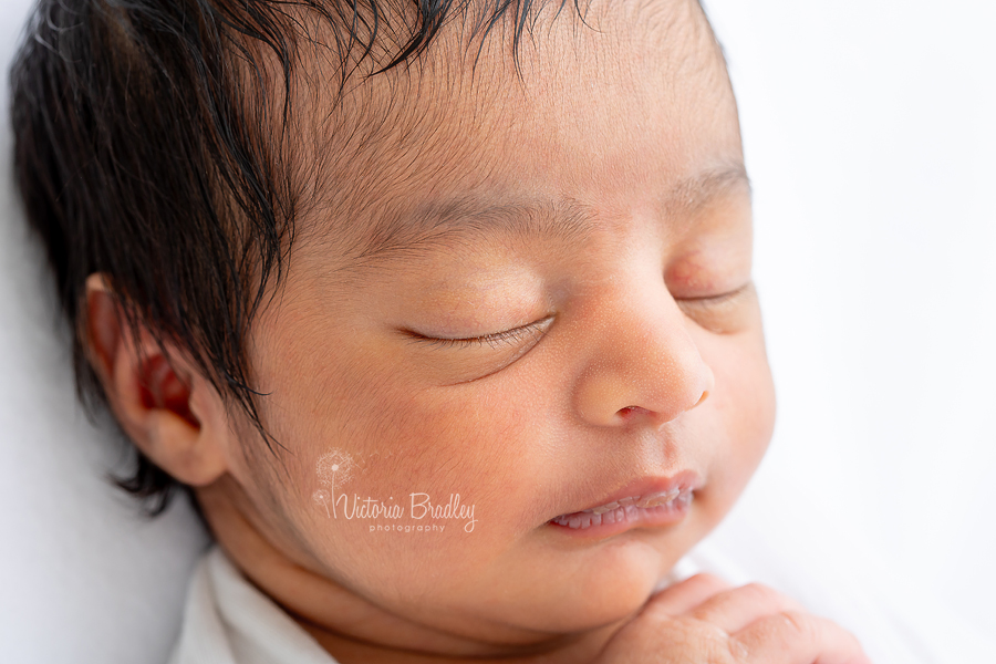 close up on newborn face photography 